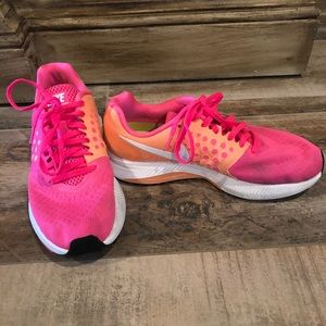 Women’s orange and pink Nike’s
